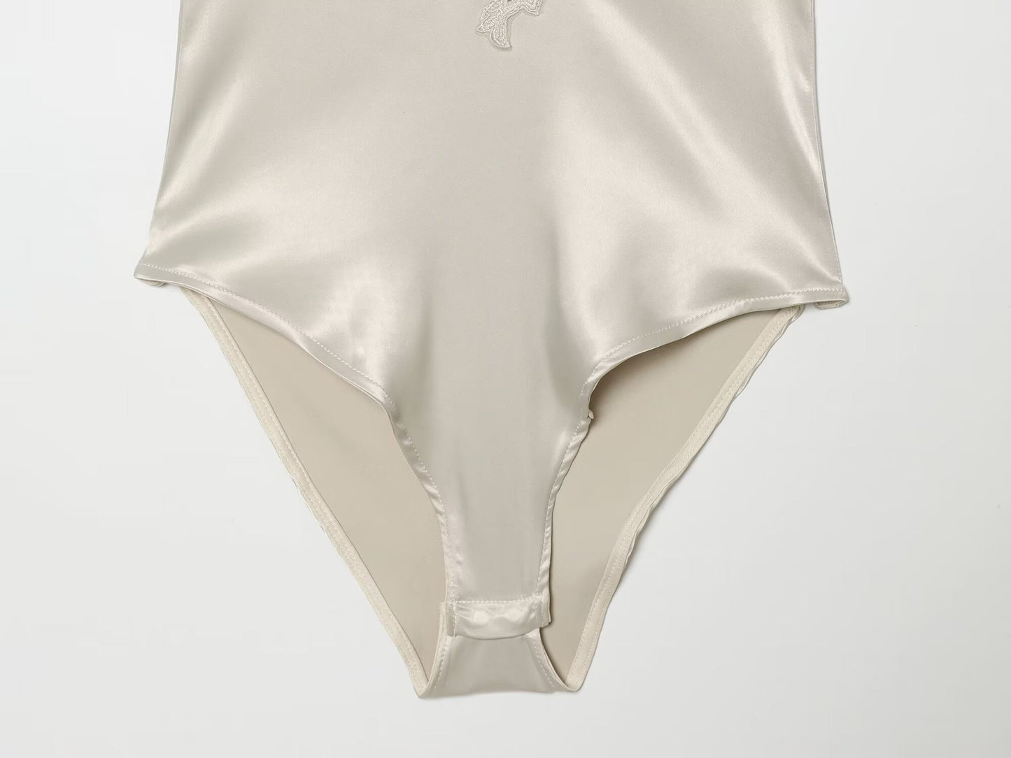 Women's lace decorated satin textured bodysuit