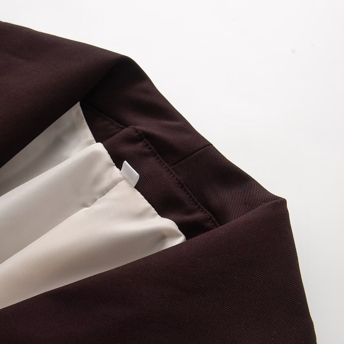 Women's long sleeved lapel short Coat